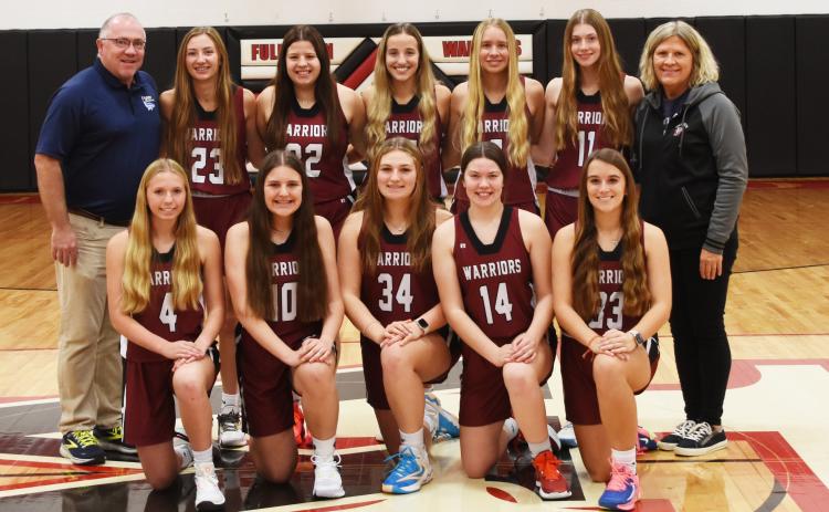 Fullerton girls basketball will look to improve throughout the entire season. This year’s team consists of Emilyn Kurz (front left), Lylla Sabata, Ella Pickrel, Georgia Bridger, Keila Dubas, Coach Jason Maxfield (back left), Makayla Robinson, Melinda Pickrel, Isabel Norman, Paige Horn, Jaci Maxfield and Coach Shelly McNeff. Photo provided