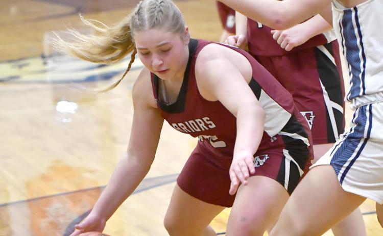 Kaycee Harter looks to make a move toward the basket in the first quarter.  NCJ photos by Rick Holtz