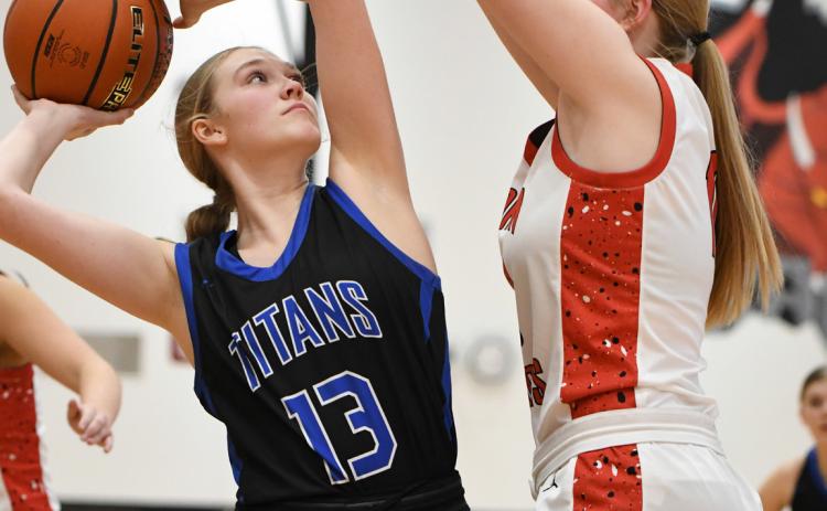 Grace Yrkoski goes up for a shot in the post on Saturday against Madison. NCJ photo by Rick Holtz