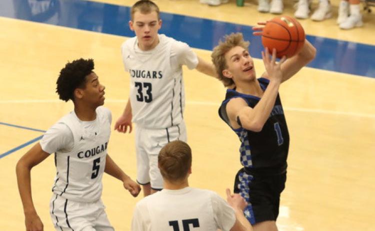 Colsten Rodriguez finishes at the basket for two of his game-high 26 points as the Titans were able to avenge a 34-point loss from 11 days earlier. NCJ photo by Ken Kush