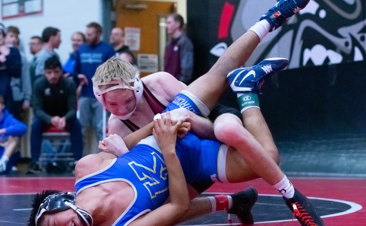 Tate Wood won his quarterfinal match against Kearney’s Jesvin Verduzco in a 13-1 major decision. He went on to win the 113 pound weight class. NCJ photo by Melissa Aaberg