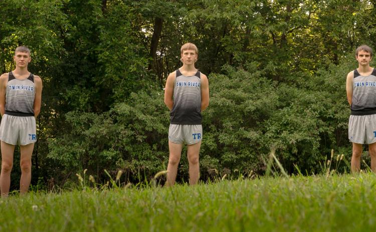 There may not be a lot of them, but fans can expect big things from the Titan cross country team. Ryker Stenzel (left), Cyrus Davenport and Carson Kershaw are an experienced group looking to show improvement each week they step out on the course. NCJ photo by Jen Johnson